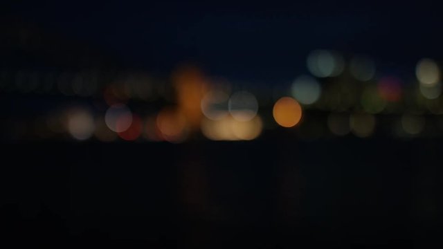 Blurred background of camera panning across a city at night