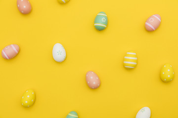 Painted easter eggs on a bright yellow background