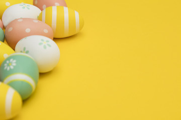 Painted easter eggs on a bright yellow background