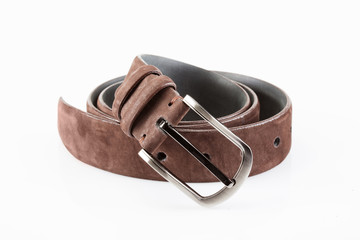 leather belt male with metal buckle, twisted on white background