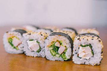 close-up shot of traditional fresh japanese sushi rolls, focus on the front piece