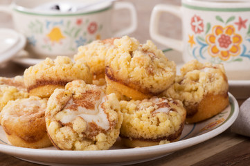 Closeup of a pile of cinnamon cream cheese coffee cake on a plate