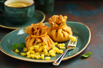 Russian pancakes stuffed with apples and caramel.