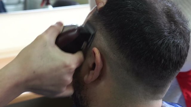 Cutting Hair Machine. Work in barber salon.