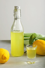 limoncello on a light background. summer traditional Italian drink of home-made liqueur from...