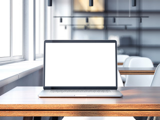 Modern laptop with blank screen on the wooden table . 3d rendering