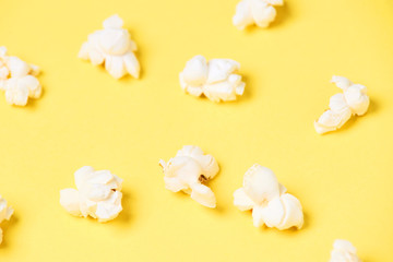 Fresh white popcorn. Yellow bright background. Fried Corn