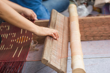 Household Loom weaving - Detail of weaving loom for homemade silk or textile production of Thailand 
