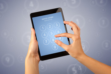 Female hand holding tablet