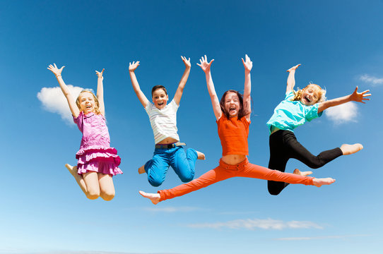 Happy active children jumping