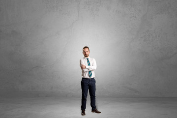 Alone businessman standing in a dark room