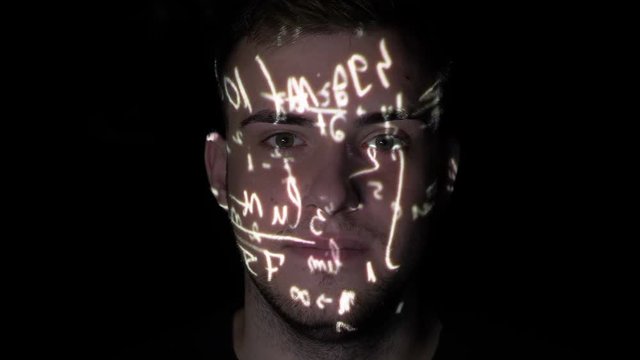 Brilliant olympic mathematician sitting on a dark background with formulas projected on his face