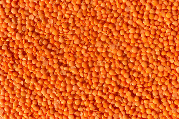 Red or orange dry lentils background, top view