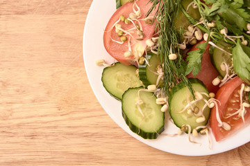 Sprouted beans. Tomato and cucumber. Fresh salad. Light background