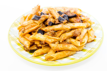pasta with aubergine and tomato sauce on a the table