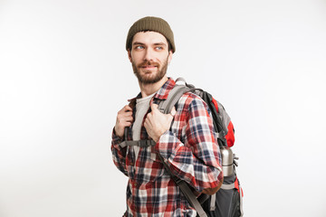 Portrait of a happy bearded man tourist in plaid shirt