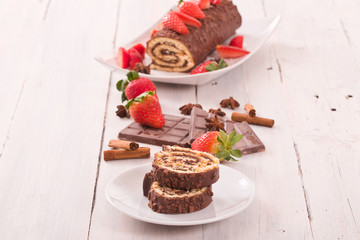 Chocolate roll with strawberries. 