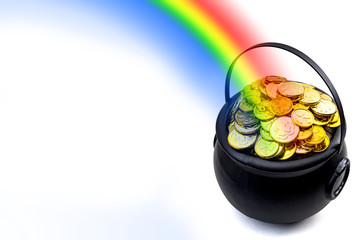 Saint Patrick's Day and Leprechaun's pot of gold coins concept with a rainbow indicating where the...
