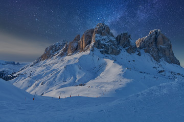 Fantastic starry sky. View of the Sassolungo (Langkofel) Group of the Italian Dolomites under...