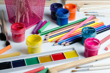 Accessories for drawing. Brushes, paints, colored pencils, chalk