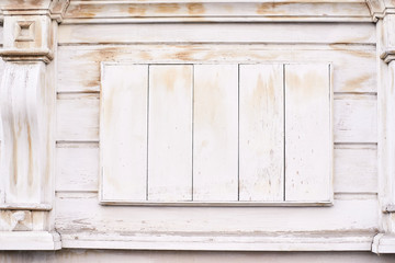 Light beige coating. Old architecture. Wooden windows