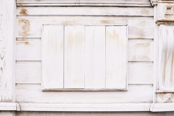 Light beige coating. Wooden windows. Old architecture