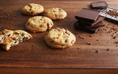 cookies with chocolate on a wooden background