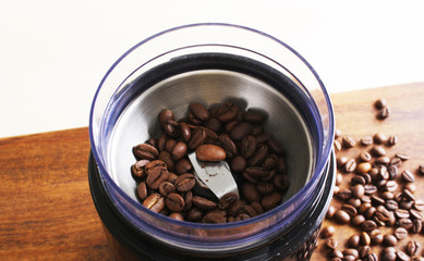 coffee beans in an electric coffee grinder