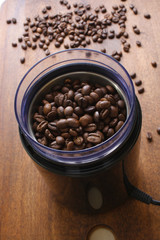 coffee beans in an electric coffee grinder