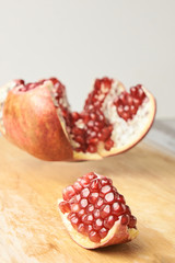 Pomegranate slices. Chopped fruit. Small red grains