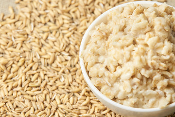 Raw porridge. Useful cooked porridge. Neutral light background