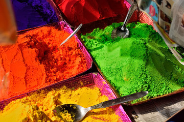 Colourful piles of powdered shopping for Holi festival 
