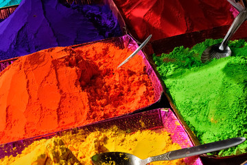 Colourful piles of powdered shopping for Holi festival 