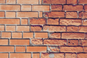 Fototapeta premium Czerwony ściana z cegieł. Stary i nowy mur