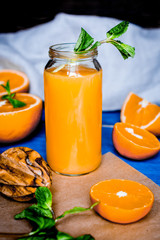 healthy morning with orange juice in bottle on kitchen backgroun