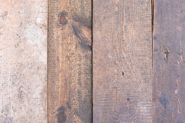 Uneven coating. Dark brown boards. Wooden wall