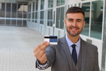 Fototapeta premium Man wearing a suit holding credit card 