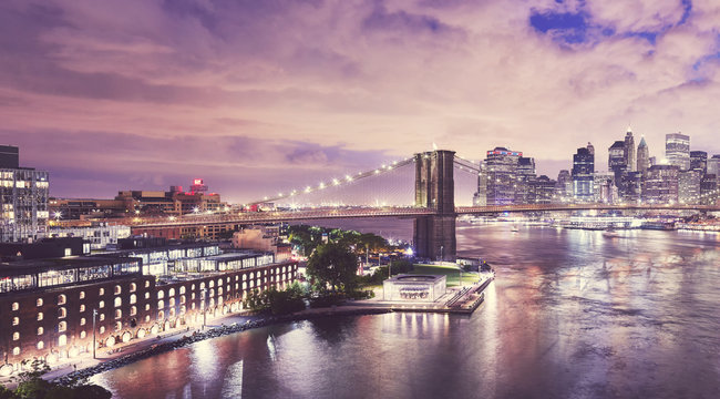 Dumbo neighborhood and the Brooklyn Bridge at night, color toned picture, New York City, USA.