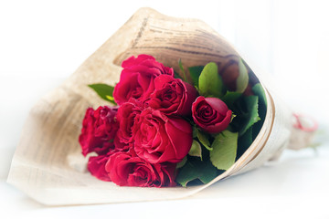 A bouquet of red roses for her