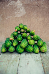 Pile of fresh organic cucumbers on a market