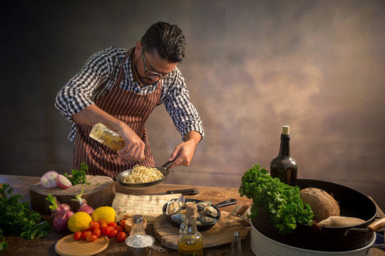 Man cook chef hipster with handsome bearded face in a hat