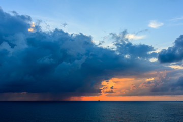 Blue sea and blue sky with white cloud and sunrise up from sea in gulf of Thailand.