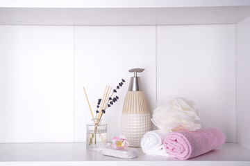 Various spa and beauty threatment products on white shelf