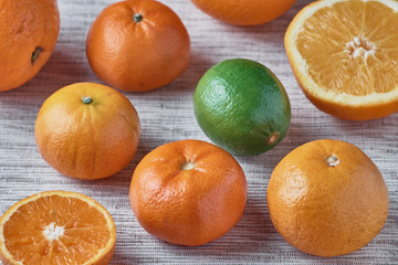 Fresh organic orange,mandorins and lime close-up. Healthy eating.