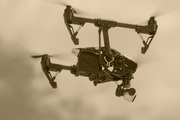 one flying small drone in a dark sky in retro style