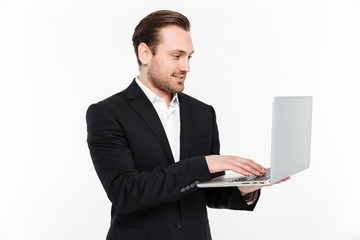 Portrait of a smiling young businessman dressed in suit