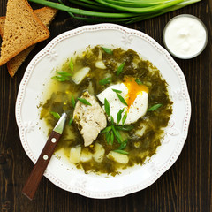 Sorrel soup with chicken and poached egg.