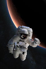 Fototapeta na wymiar Astronaut in outer space on background of the Mars. Elements of this image furnished by NASA.