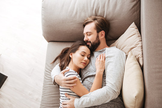 Portrait of an attractive young couple sleeping together Stock Photo |  Adobe Stock