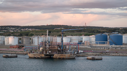 Fototapeta na wymiar Jetty of LPG LNG marine terminal in sunset